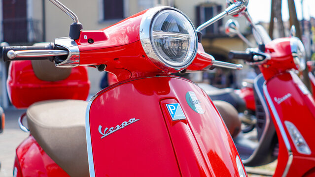new red Vescpa scooter Piaggio, lake side Piazza malvezzi, 2019 June Desenzano del Garda Italy