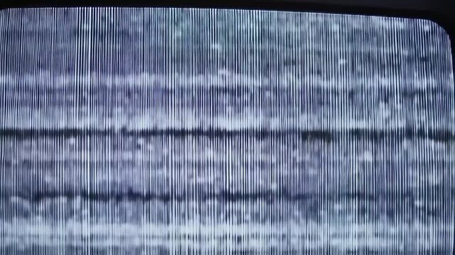 Static television screen displaying a pattern of vertical lines and noise in a rectangular frame