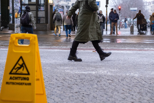  Black ice in Berlin. After several freezing cold days and rain last night, the sidewalks in Berlin-Prenzlauer Berg, such as here on Sch&ouml;nhauser Allee, are covered with a thick layer of ice. 