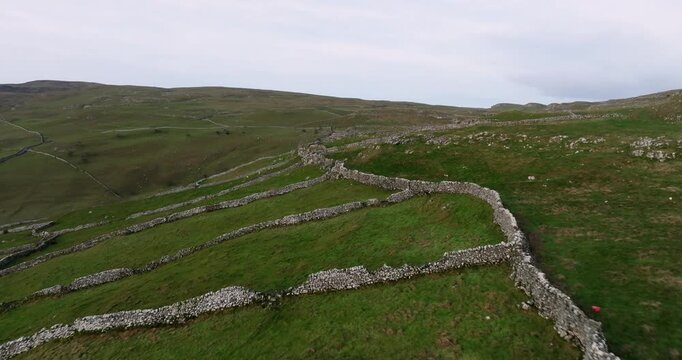 Flying above stonewalls at dawn.