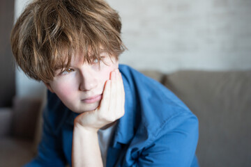 depressed teenager boy, young man, zoomer with sad eyes