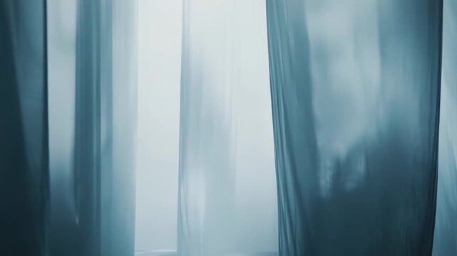 Abstract fabric or curtain forms creating subtle reflections on a dark, wet looking floor, presenting a serene, empty interior or stage background with soft ambient light