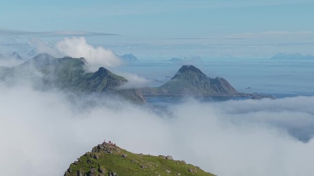 A Cloud-draped Summit With Island Views on Nonstinden, Near Ballstad, Lofoten, Norway - Orbit Drone Shot