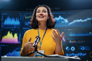 woman is giving a presentation at conference