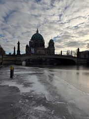 Berlin Cathedral and Friedrichsbruecke over frozen Spree river © Janica
