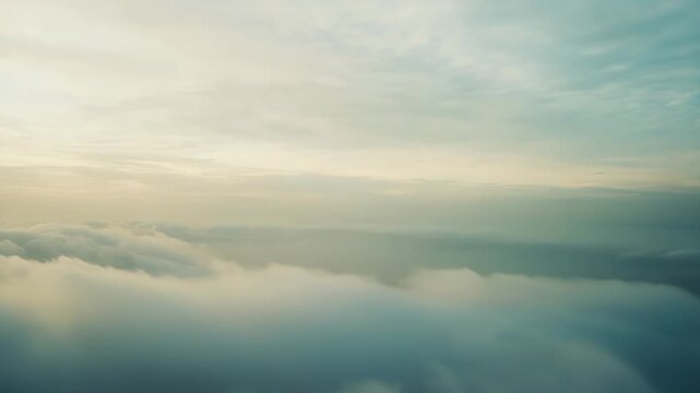 Ethereal clouds stretching endlessly across the horizon with the vast sky above, creating a serene and captivating atmospheric background for nature concepts and travel themes
