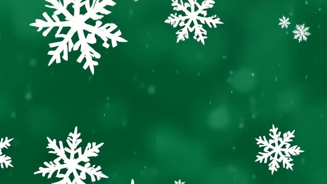 White, detailed snowflakes fall against a blurred green backdrop. Gentle, subtle snow effect