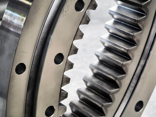 Close-up view of gear mechanism showing teeth and holes in mechanical equipment