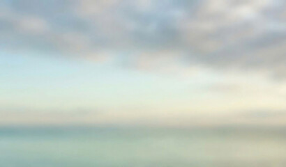 Obraz premium Blue sky with clouds over ocean reflecting sunlight