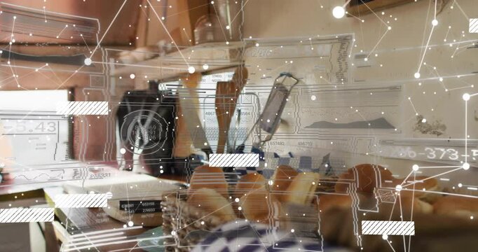 Beige-sleeved forearm placing roll on cutting board, starting reveal of toaster and coffee machine