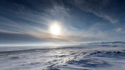Fototapeta premium Pale sun low in the sky above a wind-blasted permafrost plateau. Life in permafrost conditions, climate change problems on the planet. Global warming