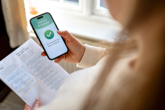 Utility bills paid successfully using mobile banking app. Household expenses and digital payment concept.