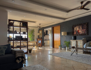 Fototapeta premium Home interior with modern furniture, white sofa, wooden table, and large window filling the living