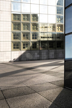 Modern Paris urban architecture plaza with glass facade shadow and office minimalism for clean corporate branding background design