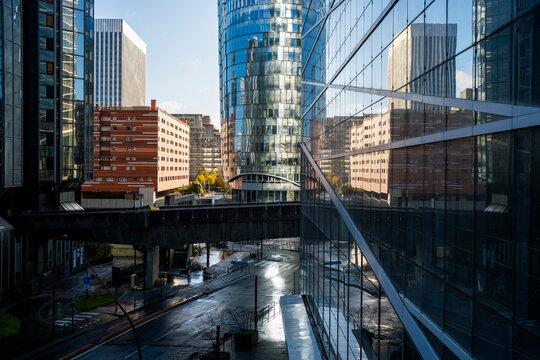 Modern Paris urban cityscape architecture with glass skyscraper bridge reflection and office towers in busy financial district perspective