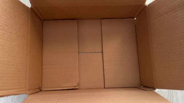 Empty cardboard box with no items inside on white background  