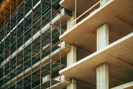 Reinforced concrete form structural building construction site with scaffolding