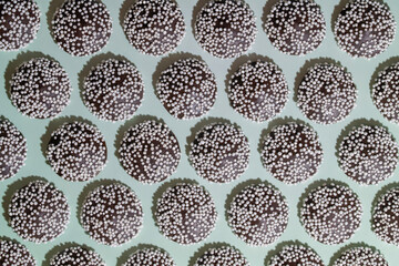 Rows of Nonpareils Dark Chocolate Candies