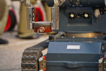 Naklejka premium A minesweeper robot for mine clearance. Military exercises.