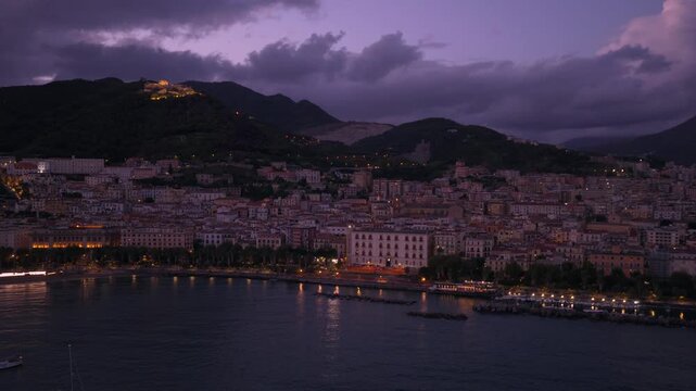 Seafront City Of Salerno Illuminated At Night In Italy - Drone Shot
