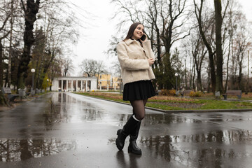 Adult girl talking on the phone in the park