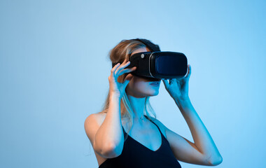 Female designer adjusting virtual reality headset while working with immersive digital design...