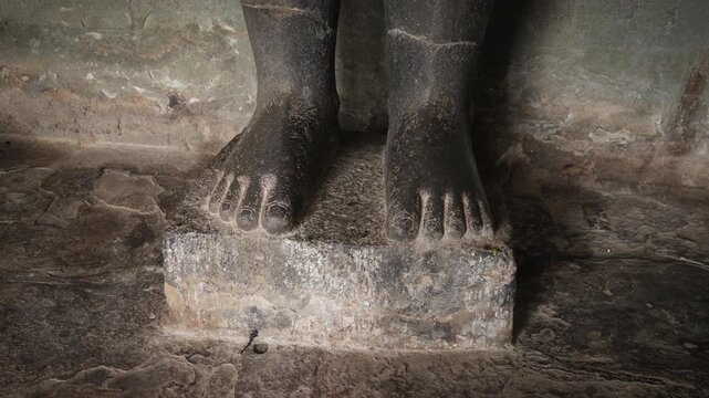 SIEM REAP, CAMBODIA - OCTOBER 27, 2025: Interior view of the ancient stone corridors and galleries within Angkor Wat. Featuring rows of weathered pillars, traditional Khmer window balusters, and the a