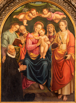 VERCELLI, ITALY - JANUARY 17, 2026: The painting of Madonna among the sanits in the church Chiesa di Sant'Agnese in San Francesco by Giuseppe Giovenone il Giovane (1570).