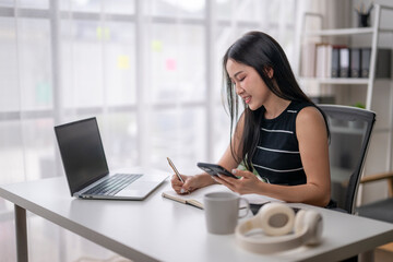 Young professional woman working in modern office