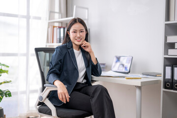 Confident businesswoman working in modern office