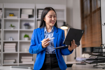 Professional woman engaging with digital tablet in office