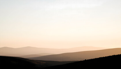 Serene mountain background with fog and warm tones