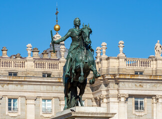 Monument to Felipe IV on Eastern square (Plaza de Oriente) and Royal palace of Madrid, Spain