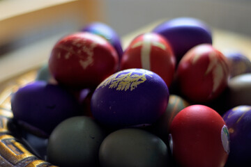 Colorful Easter eggs in a decorative bowl