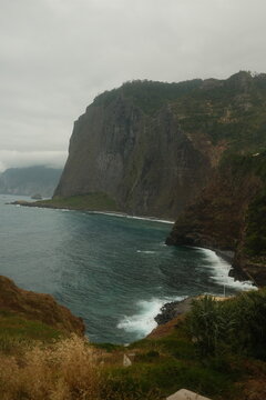 Dramatic Cliffs Towering Above Atlantic Ocean with Waves Crashing Against Rocky Shoreline