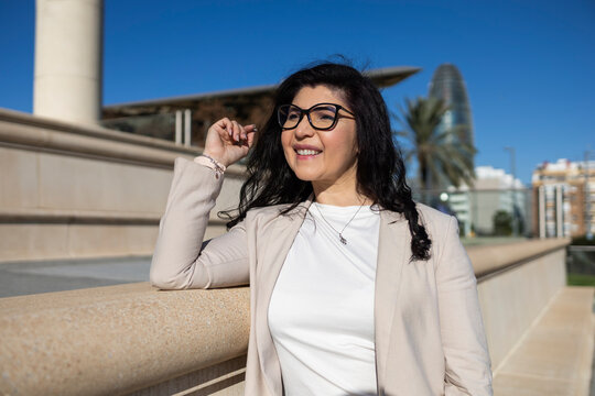 Confident businesswoman standing outdoors smiling