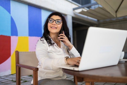 Confident businesswoman in outdoor workspace