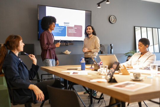 Diverse team collaborating in modern office setting