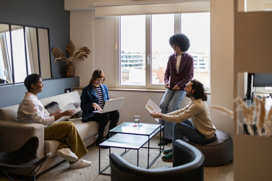 Diverse team collaborating in modern office space