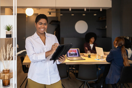 Diverse team collaborating in modern office setting