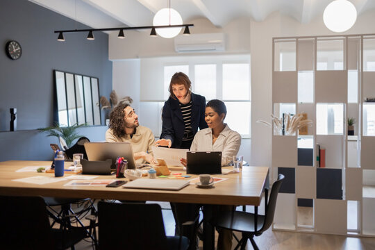Diverse team collaborating on office project