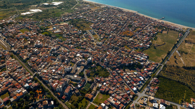 Aerial view of the town of Gioia Tauro, located in the province of Reggio Calabria, Italy. It is a Calabrian city located near the coast overlooking the Tyrrhenian Sea.
