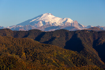 Landscape of the snow-capped mount Elbrus at sunset in the autumn