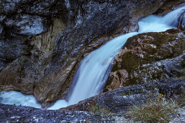 Waterfall flowing through the Gleiersch Gorge near Scharnitz in the Austrian Alps.