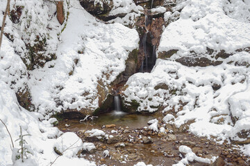 Waterfall flowing through the Gleiersch Gorge near Scharnitz in the Austrian Alps.