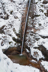 Waterfall flowing through the Gleiersch Gorge near Scharnitz in the Austrian Alps.