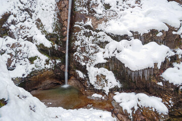 Waterfall flowing through the Gleiersch Gorge near Scharnitz in the Austrian Alps.