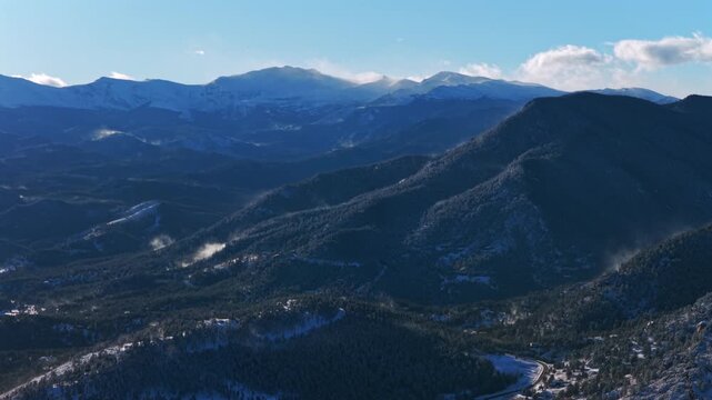 Winter snowy Mount Blue Sky Mt Evans Evergreen Colorado aerial drone windy sunny blue sky Front Range Rocky Mountains Witter Gulch Troutdale Village Upper Bear Creek Road Chief Mountain forward motion