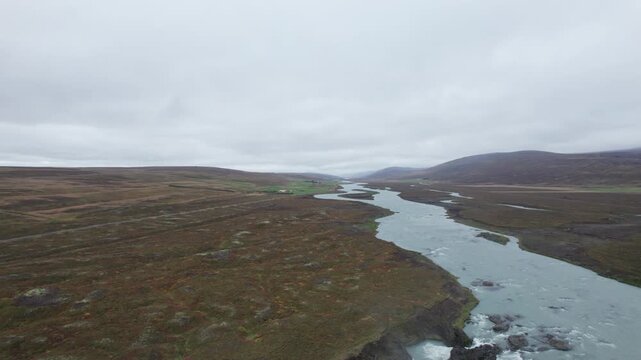 Aerial shot of the river that forms Godafoss Waterfall in northern Iceland