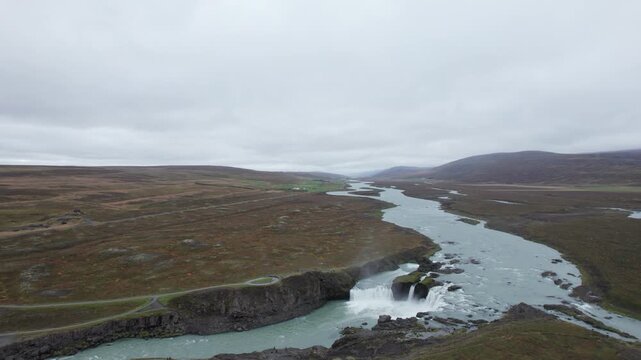 Aerial drone shot flying along the river downstream of Godafoss Waterfall in northern Iceland